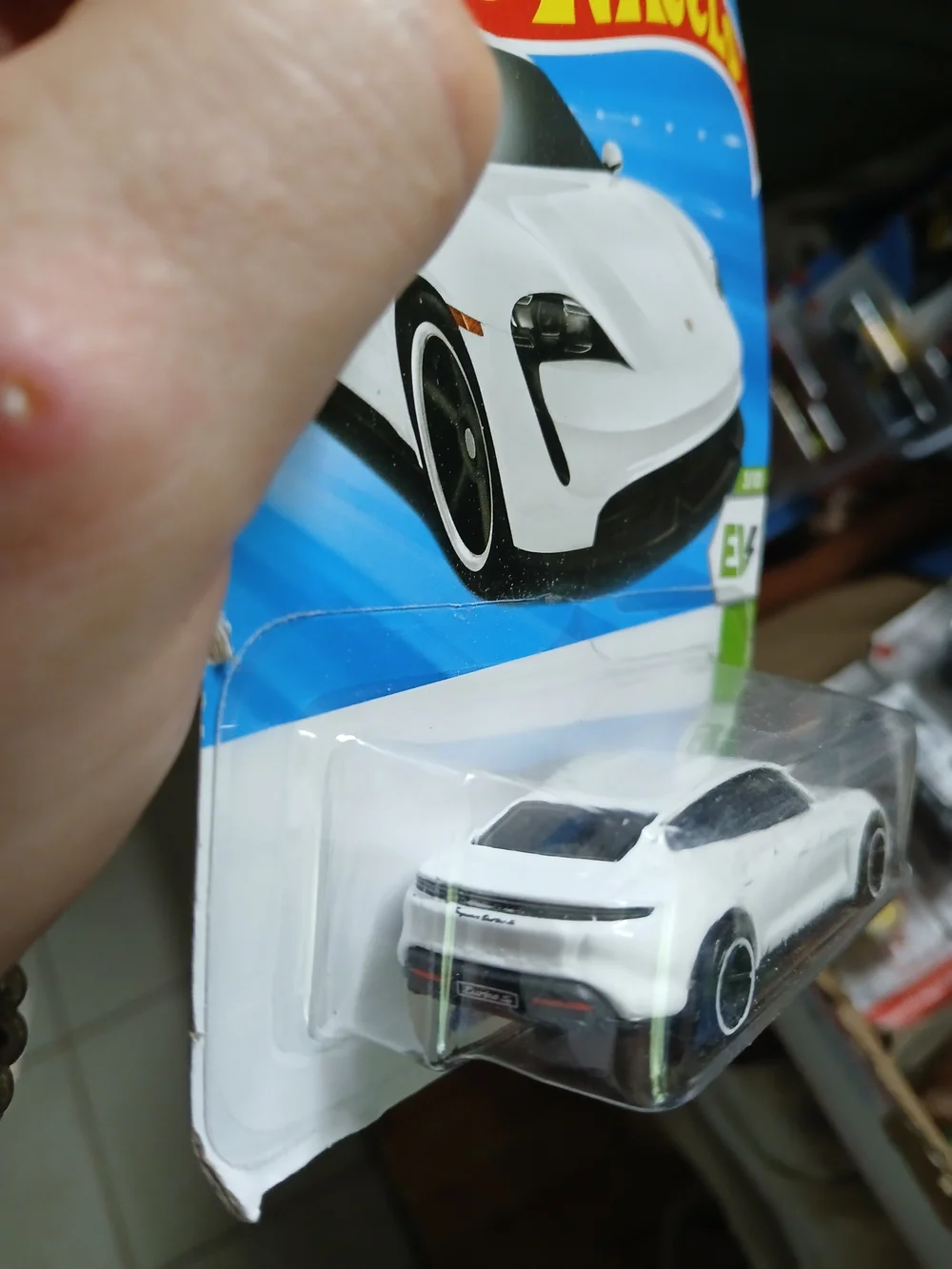 white Hot Wheels Porsche Taycan Turbo S from the 2026 HW EV series (3/10, number